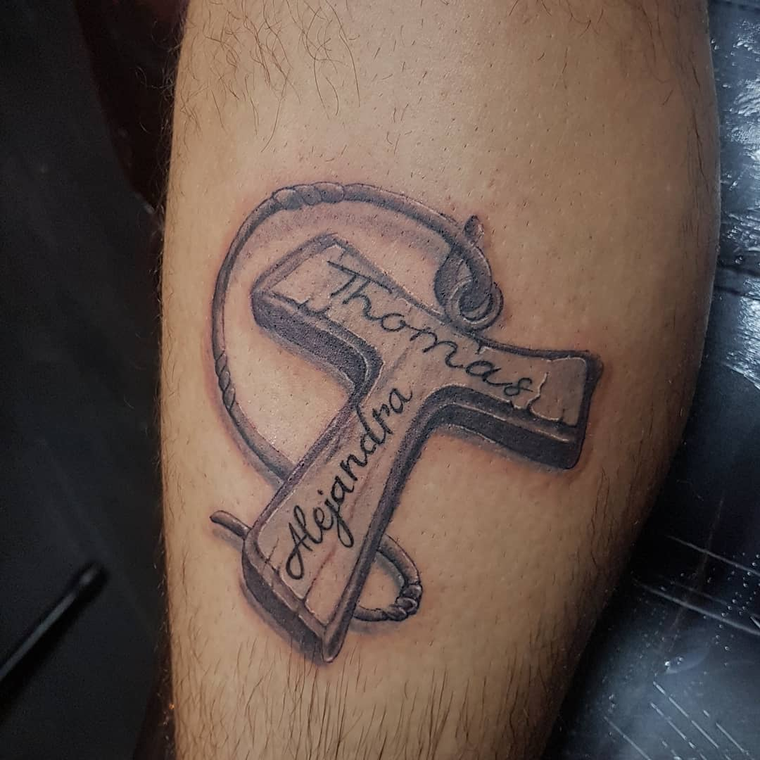 Tau cross tattoo
