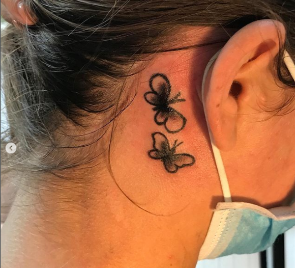 small butterfly tattoos behind the ear