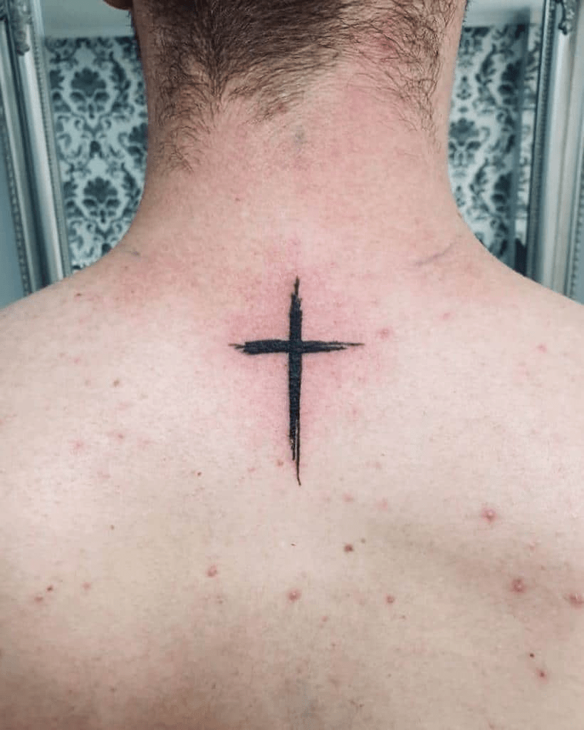 cross tattoo on the neck