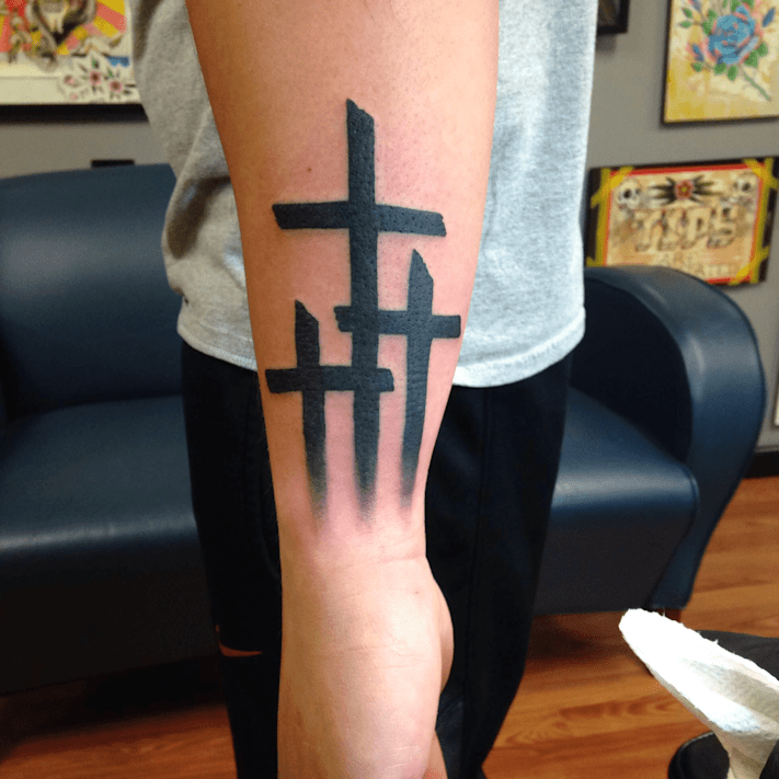 cross tattoo on hands