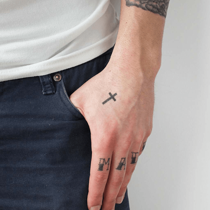 Harry Styles Cross Tattoo on His Hand PopStarTats