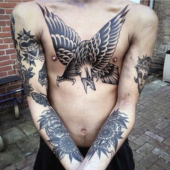 Single needle hawk tattoo on Taika Waititis chest