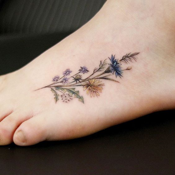 Girly foot tattoo