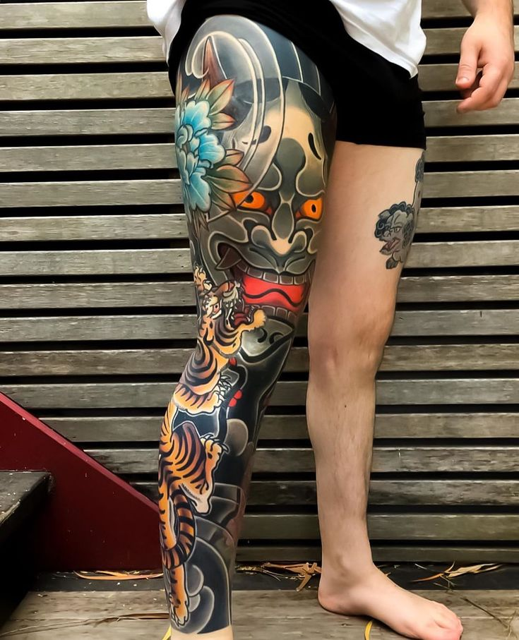 upper leg tattoos for men