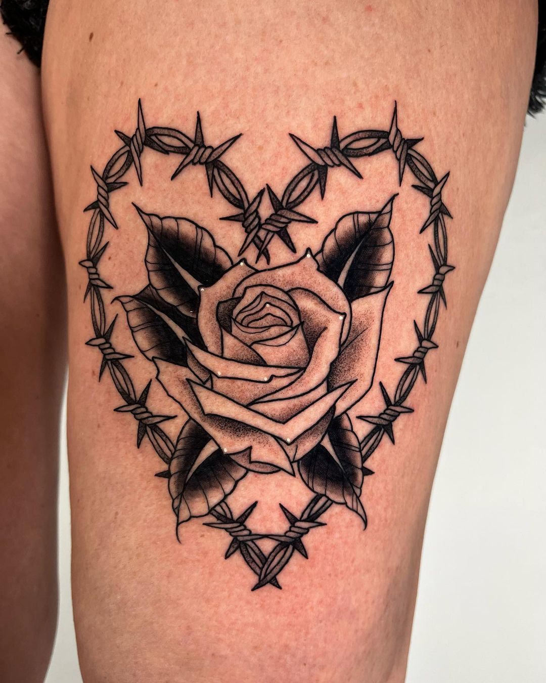 Barbed wire rose tattoo