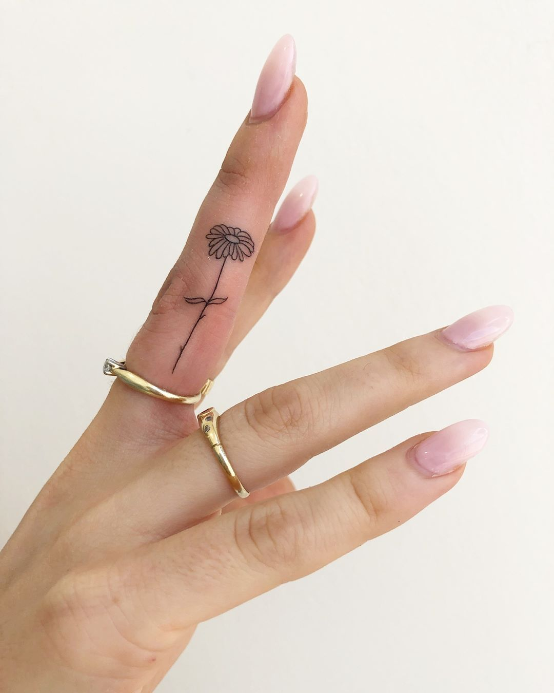 Tattoo uploaded by Tattoodo  Finger flowers tattoo by Olga Handpoke  olgahandpoke handpoketattoos color flower floral finger matching  cute daisy daisies leaves nature nonelectric stickandpoke  Tattoodo