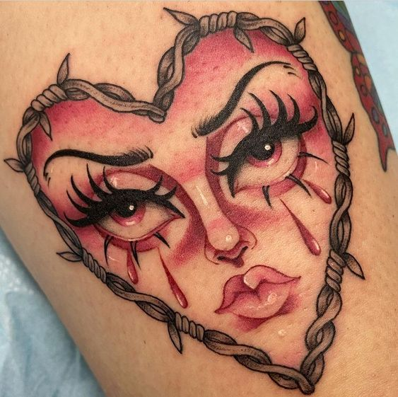 Barbed wire heart tattoo