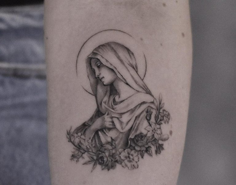 Small Catholic Mary tattoo on the arm