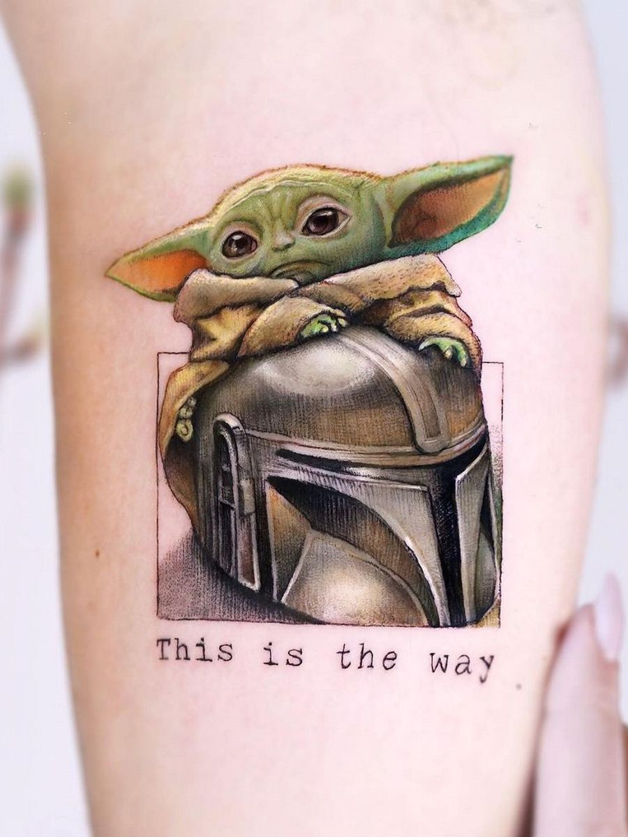 Baby Yoda with other elements This design is perfect for those who want a tattoo that represents the character in a more unique way. You can choose to include elements such as the Millennium Falcon, lightsabers, or other stuff from the series.