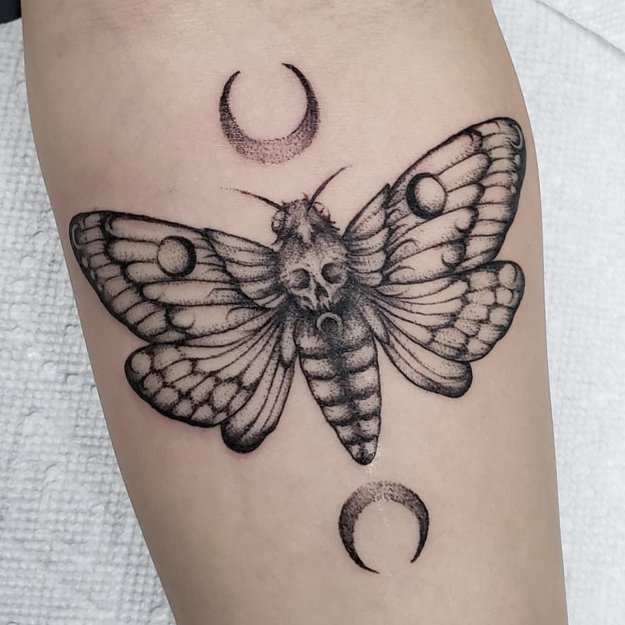 Moth tattoo on the arm