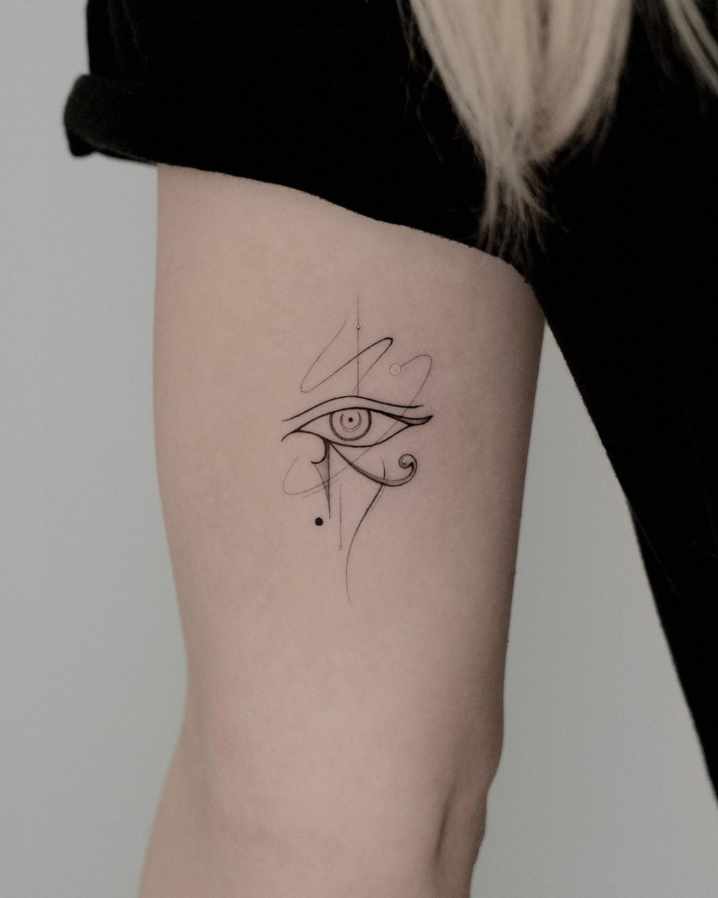 Grey Ink Egyptian Isis And Horus Eye Tattoo On Upperback