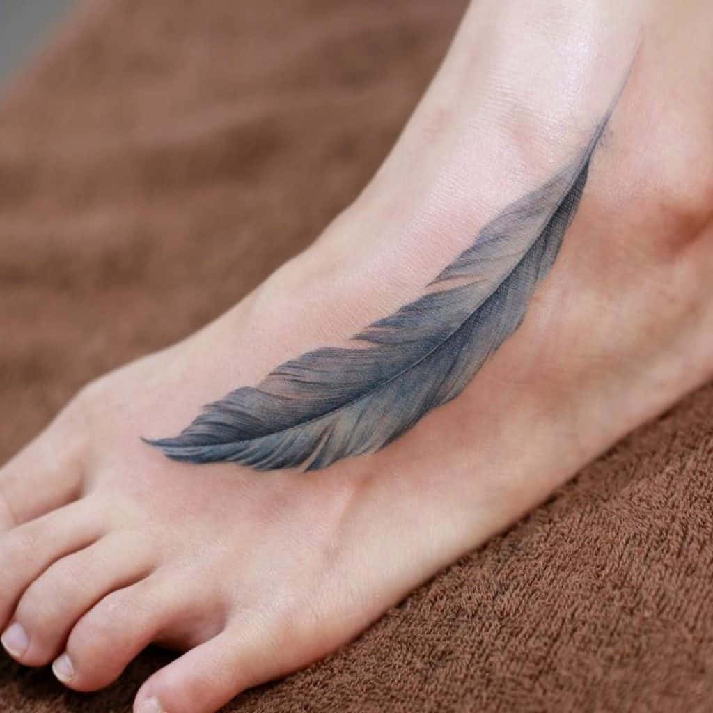 Feathers on the foot tattoo
