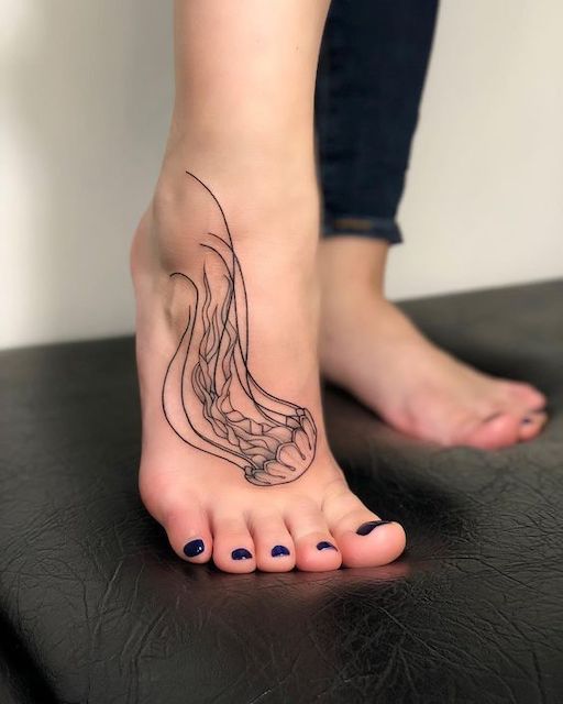 The marine theme on the foot tattoo