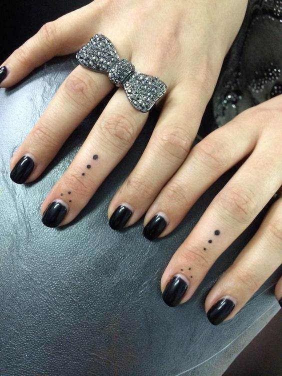Dots on fingers tattoo meaning