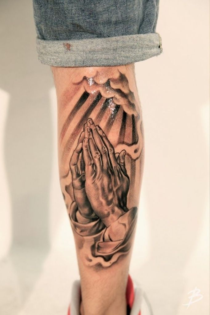 Tattoo with praying hands