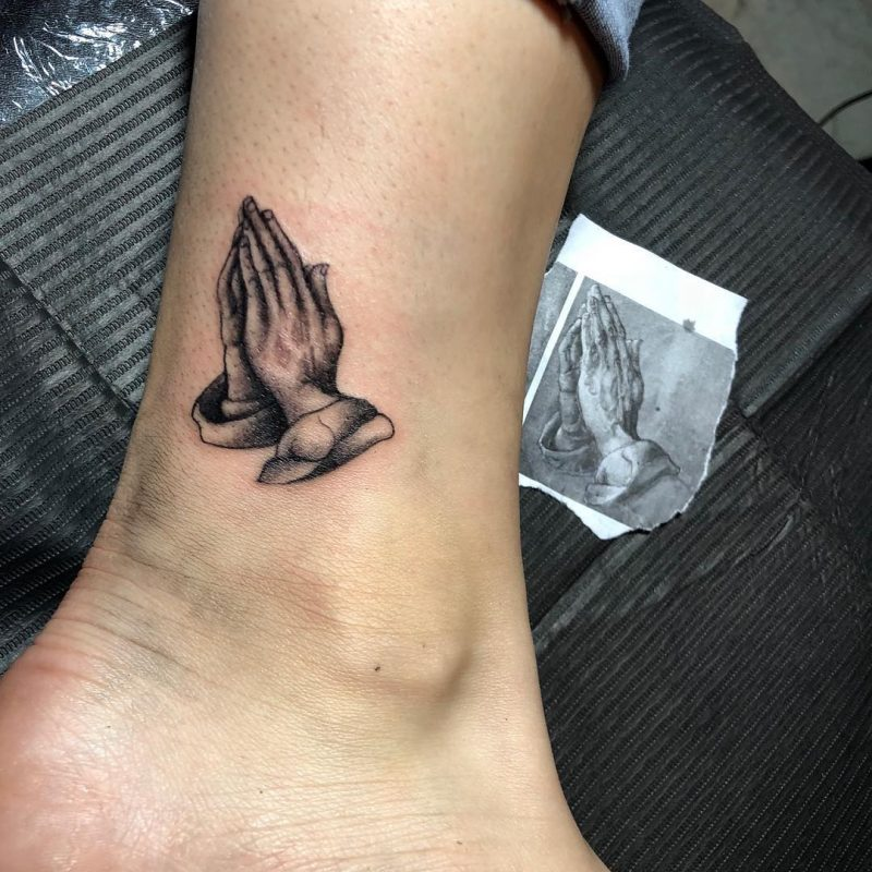 Durers Praying Hands tattoo on Bobby Newberrys inner
