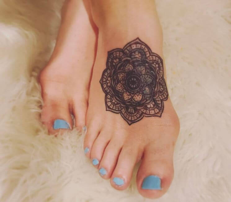 Magic mandala foot tattoo design
