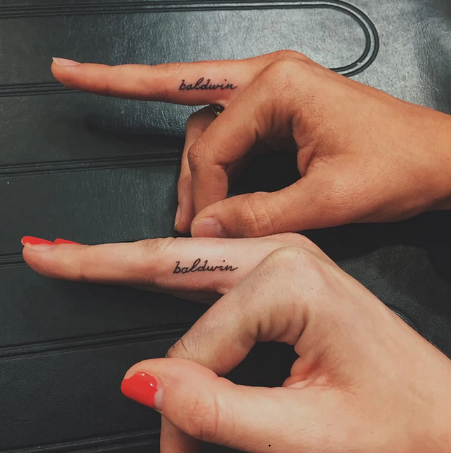 Minimalistic infinity symbol tattooed on the finger.