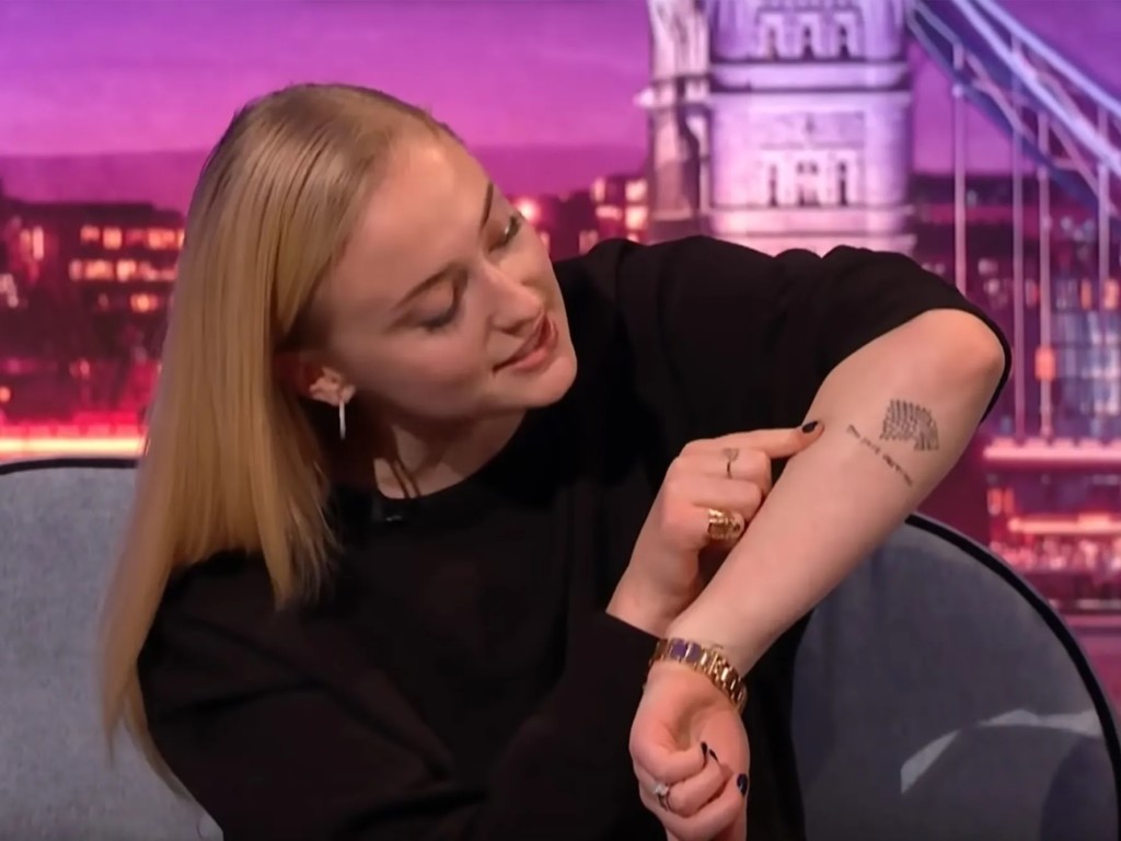 Sophie Turner, from the Game of Thrones, has a wolf tattoo on her left arm. Under the House Stark’s emblem, it is written: “the pack survives.”