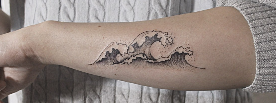 Tiny wave tattoo on the inner arm - Tattoogrid.net