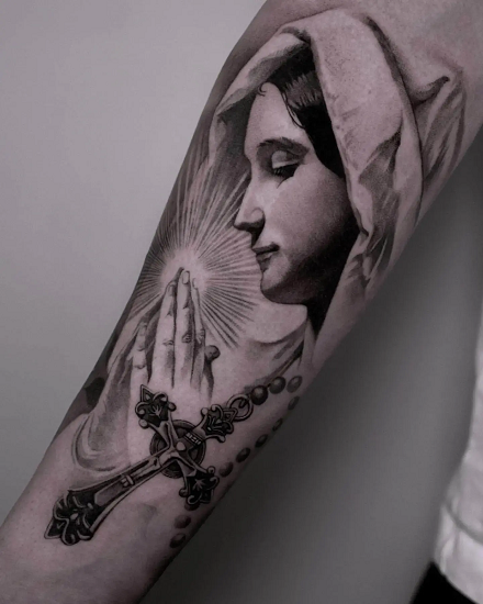 Minimalistic tattoo representation of Virgin Mary,