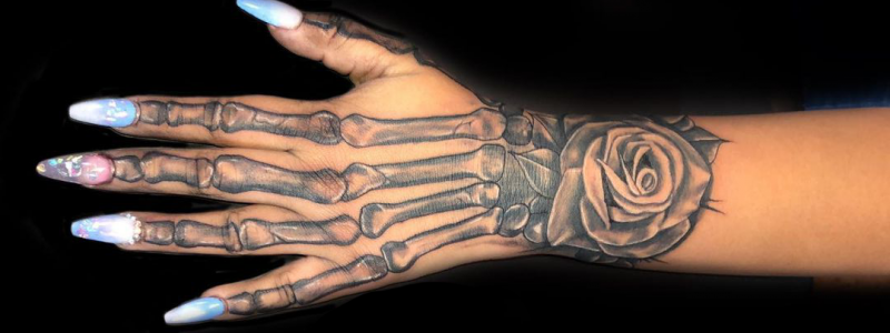 Female skeleton hand tattoo
